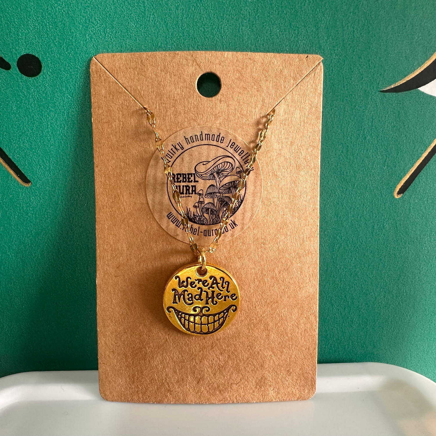 “We’re All Mad Here” Alice In Wonderland Gold Charm Necklace