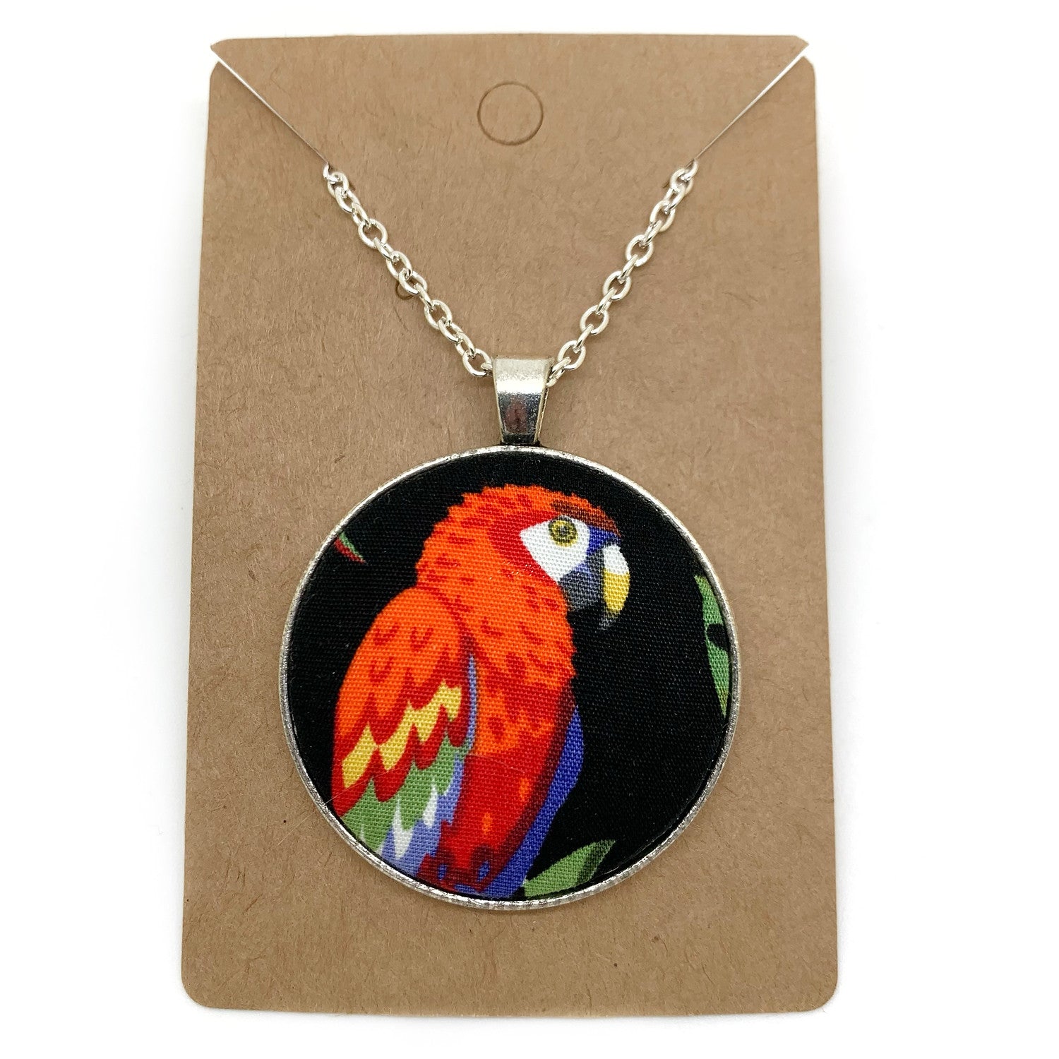 Parrot on black fabric button necklace — Rebel Aura handmade jewellery