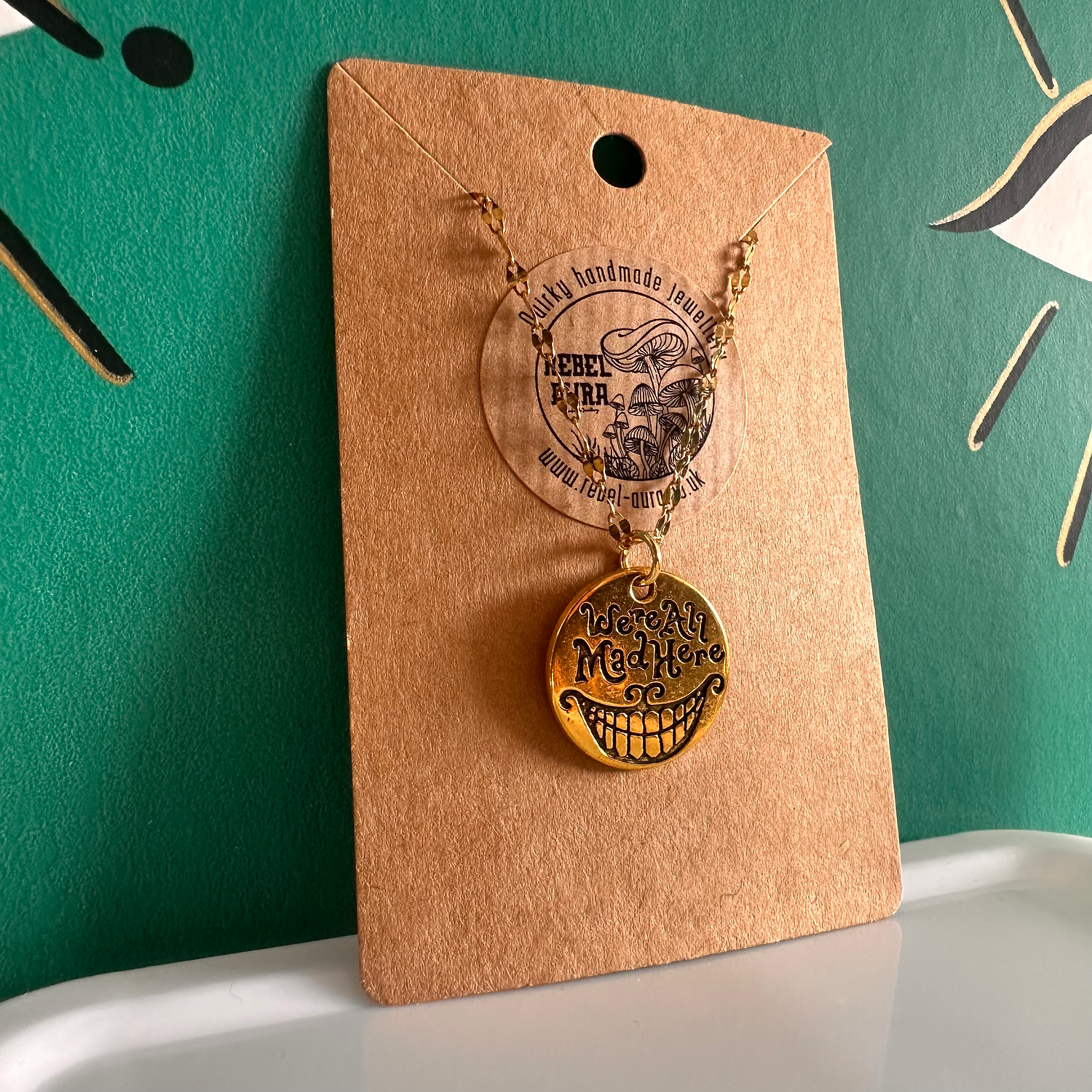 “We’re All Mad Here” Alice In Wonderland Gold Charm Necklace