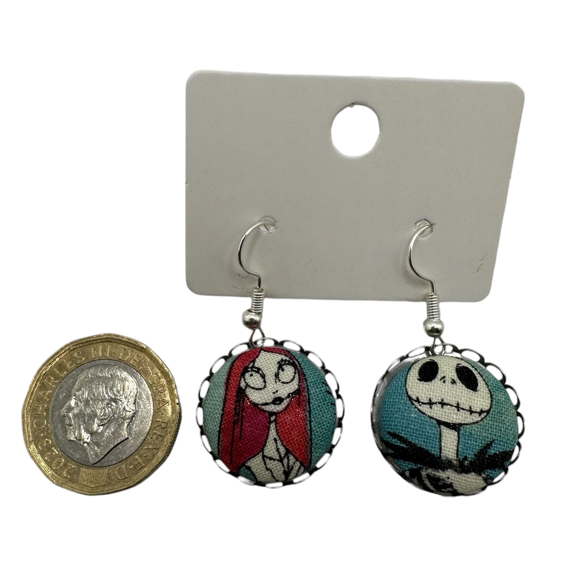 Jack Skellington fabric button drop earrings on display card
