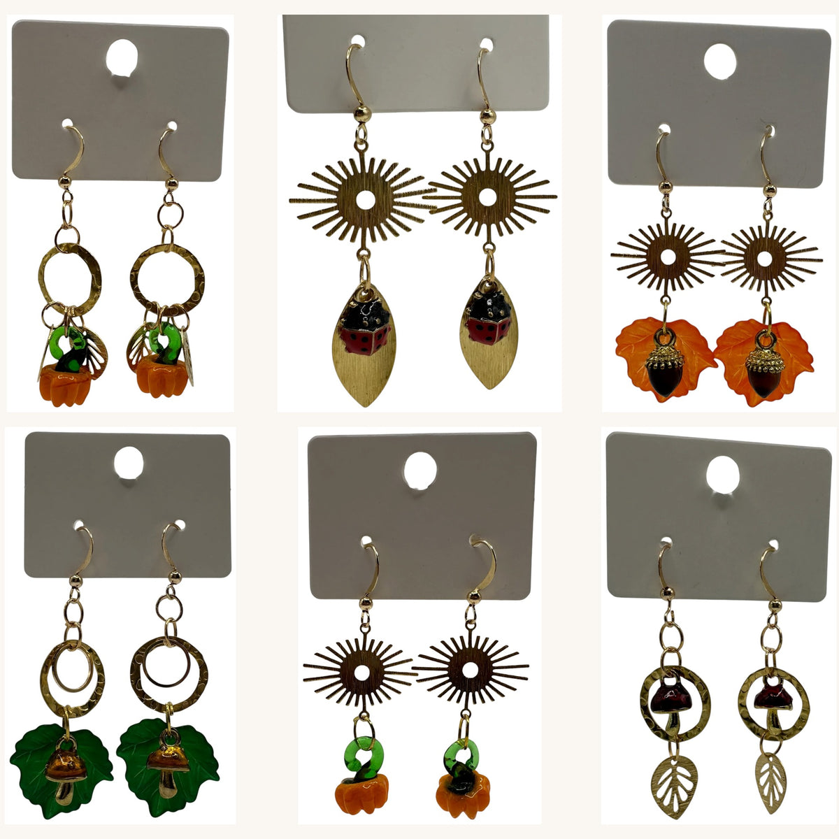 Autumn Edition collection – a small batch of champagne gold-tone earrings with acorn, toadstool, pumpkin and ladybird charms