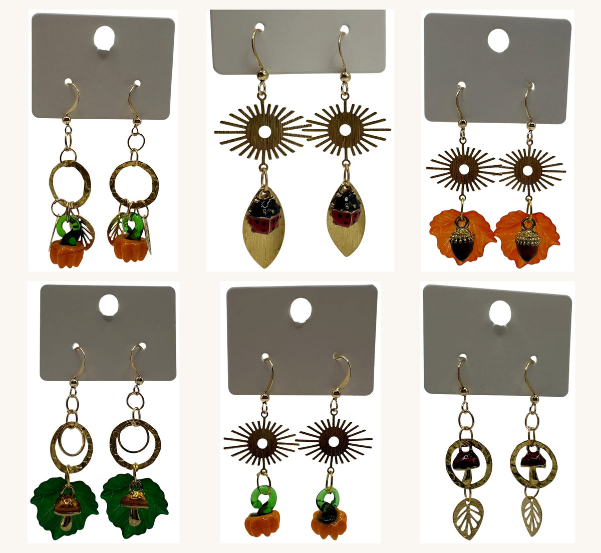 Autumn Edition collection – a small batch of champagne gold-tone earrings with acorn, toadstool, pumpkin and ladybird charms