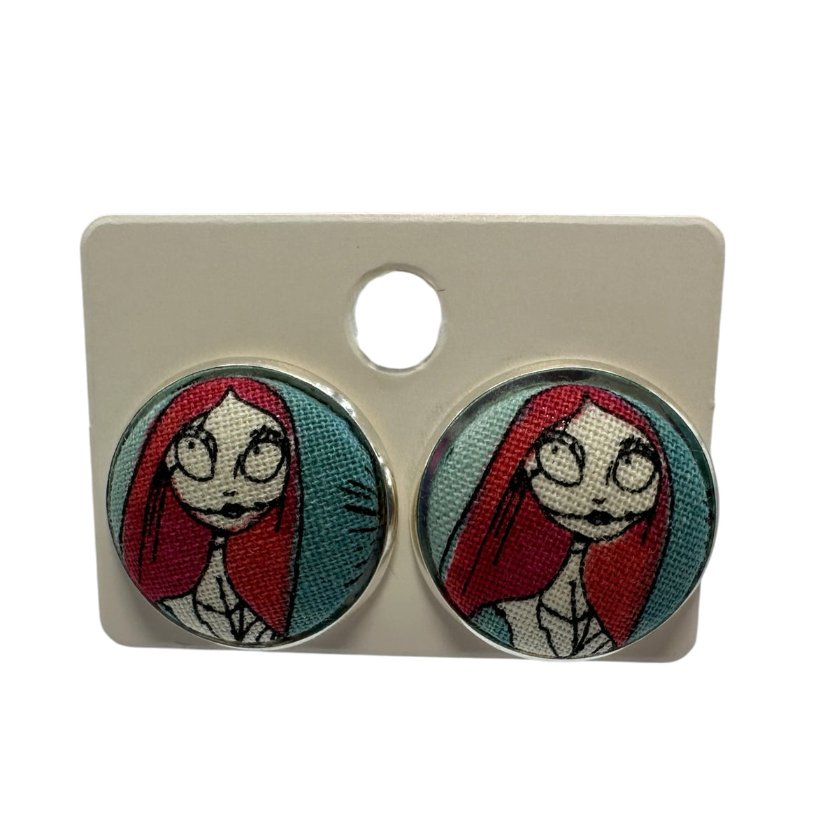 Jack Skellington fabric button stud earrings on display card