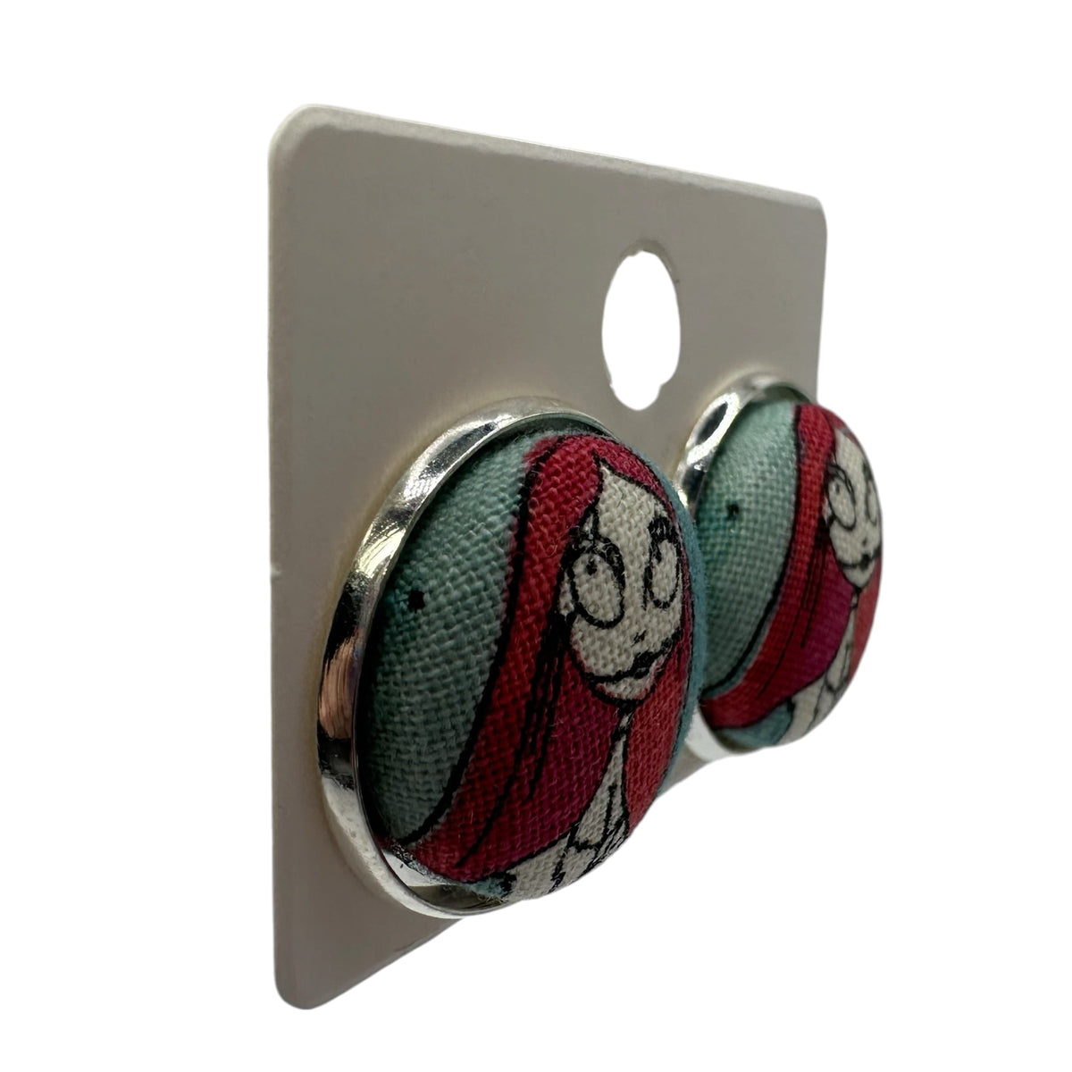 Sally fabric button stud earrings on display card