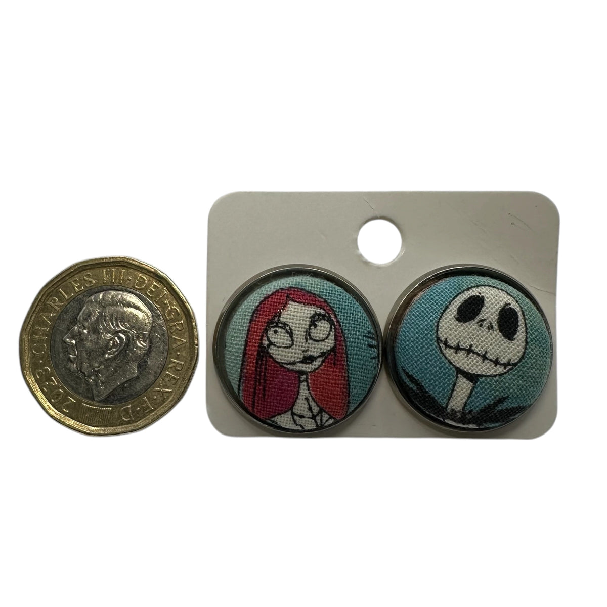 Nightmare Before Christmas Sally stud earrings, fabric button in silver tone tray